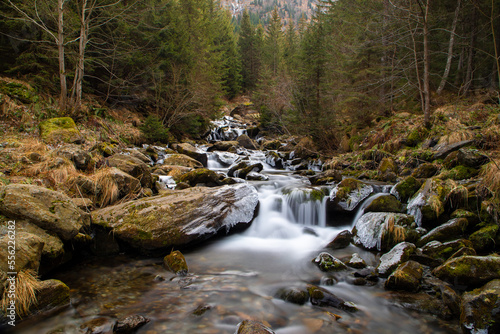 a stream that flows in the mountains in late autumn