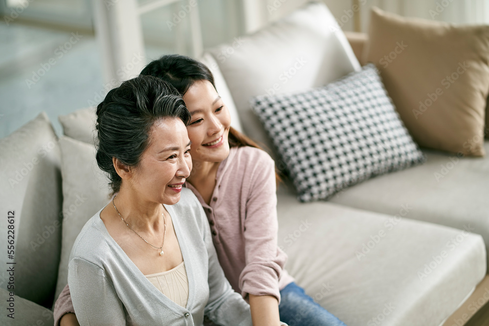 portrait of asian senior mother and adult daughter portrait of asian senior mother and adult daughter