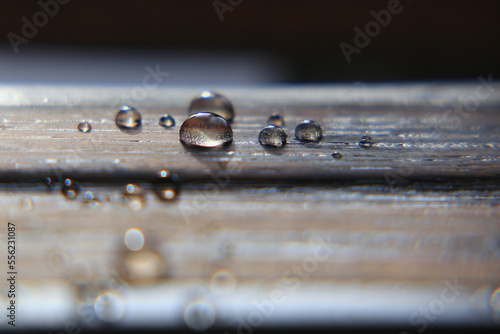 Close up of water drops on impregnated wooden surface