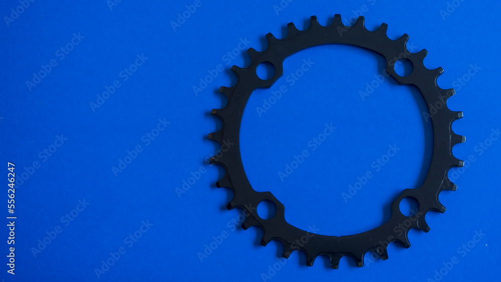 Bicycles chainring on blue background Bicycles chainring on blue background