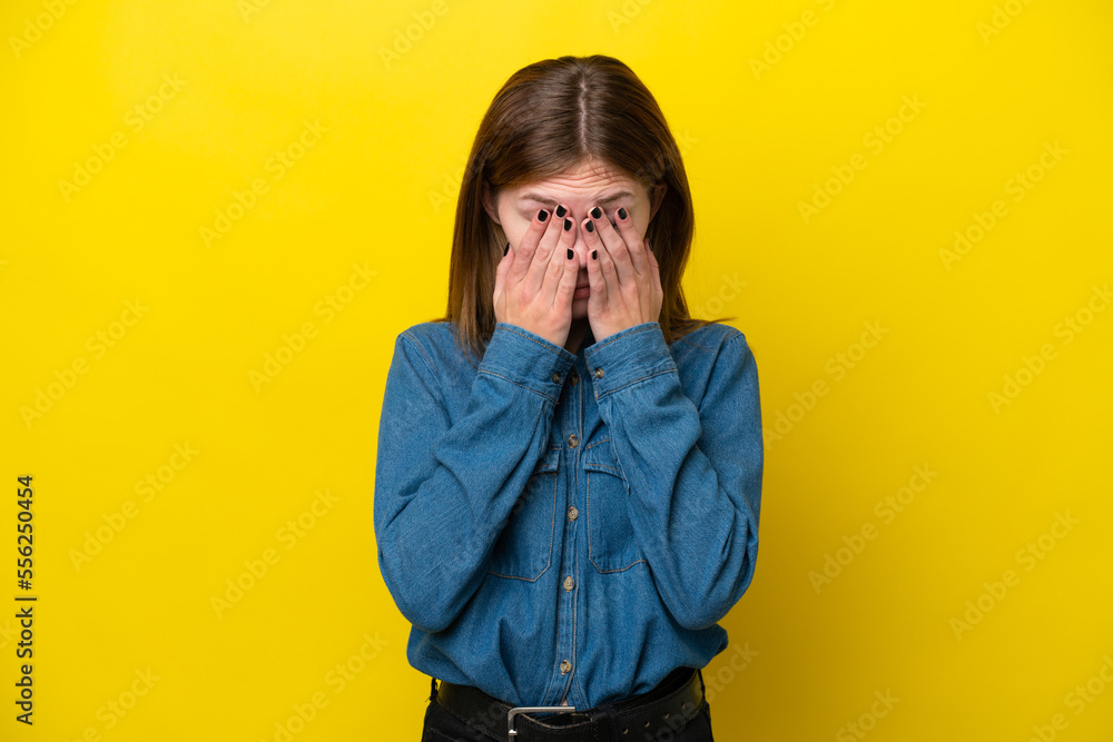 Young English woman isolated on yellow background with tired and sick expression Young English woman isolated on yellow background with tired and sick expression