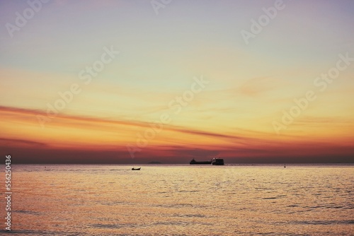 silhouette  ship and boat on sea at evening  