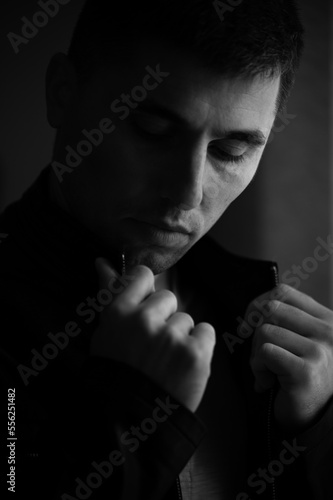 Картината върху платно Monochrome portrait of a man with light from the window.