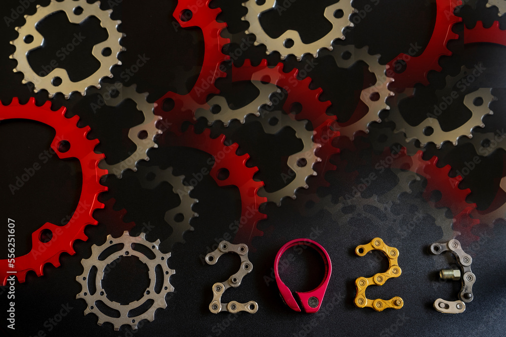Illustration backgrounds of 2023 number with bike parts design on black background for Happy New Year greeting card