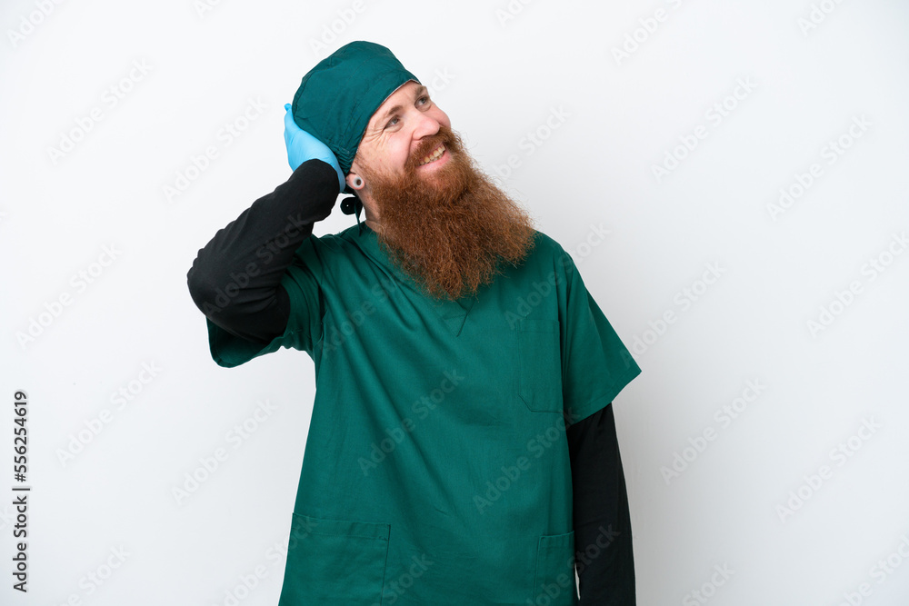 Surgeon redhead man in green uniform isolated on white background thinking an idea Surgeon redhead man in green uniform isolated on white background thinking an idea