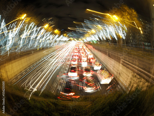traffic jam in madrid castilla place at night with car lights tracks