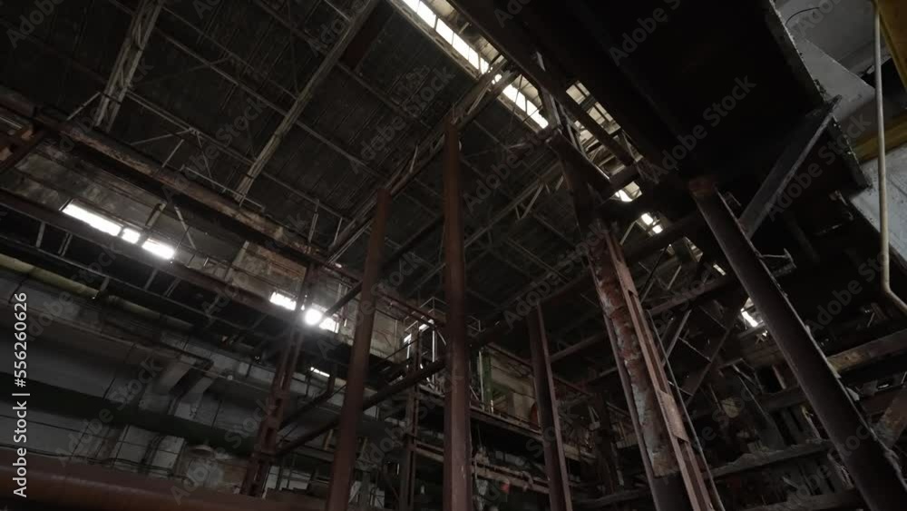 The interior of the destroyed production in the factory since the days of the Soviet Union. Dolly camera shot The interior of the destroyed production in the factory since the days of the Soviet Union. Dolly camera shot
