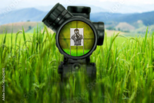 Bolt action sniper rifle aiming on target at shooting range. Image of a rifle scope sight used for aiming with a sniper weapon