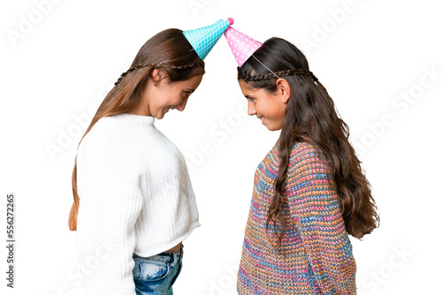 Friends girls in a birthday over isolated chroma key background