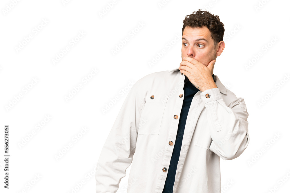 Brazilian man over isolated chroma key background doing surprise gesture while looking to the side Brazilian man over isolated chroma key background doing surprise gesture while looking to the side