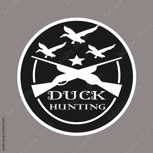 duck hunter logo with duck image and firearm