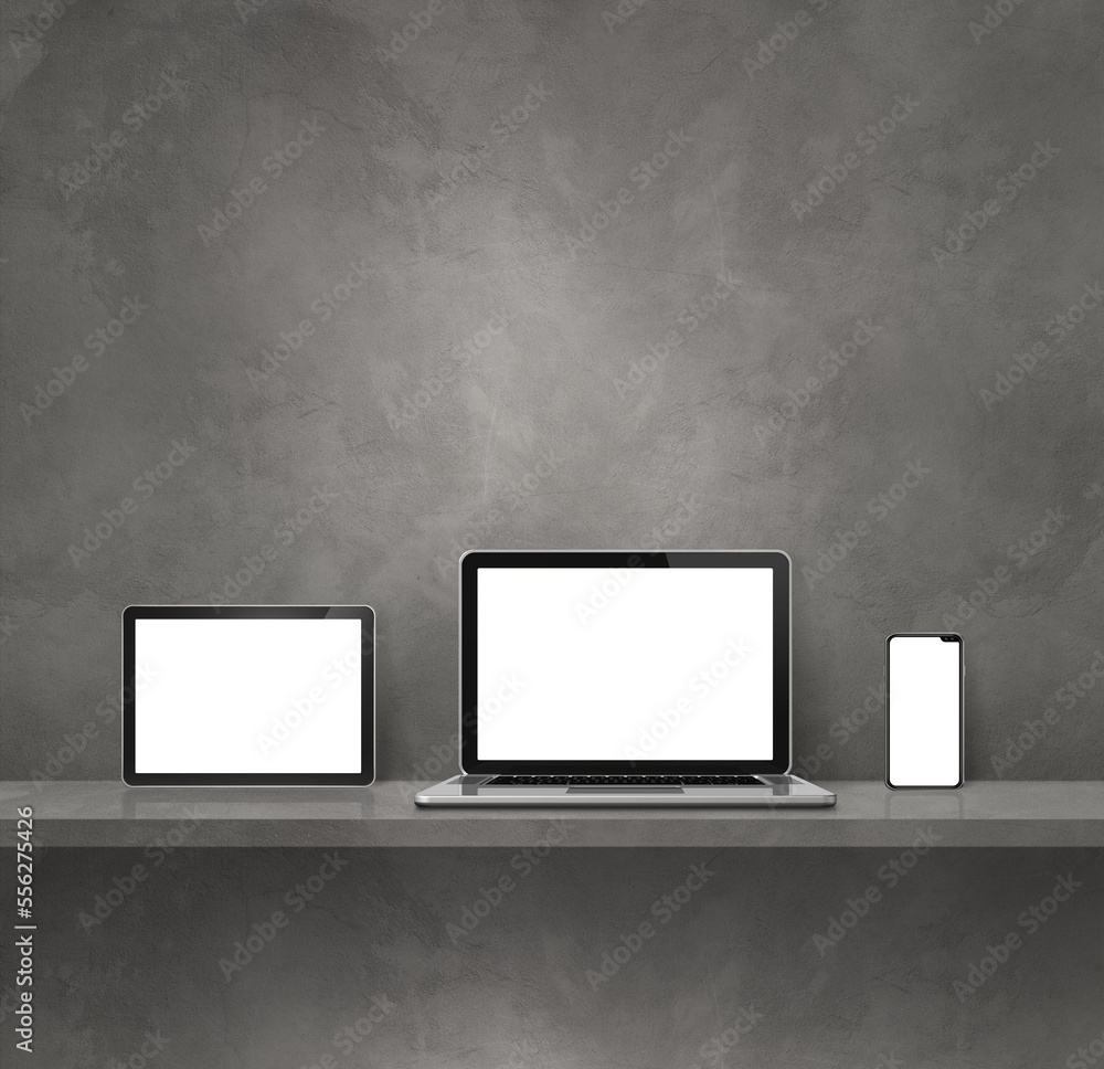 Laptop, mobile phone and digital tablet pc on grey wall shelf. Square background Laptop, mobile phone and digital tablet pc on grey wall shelf. Square background