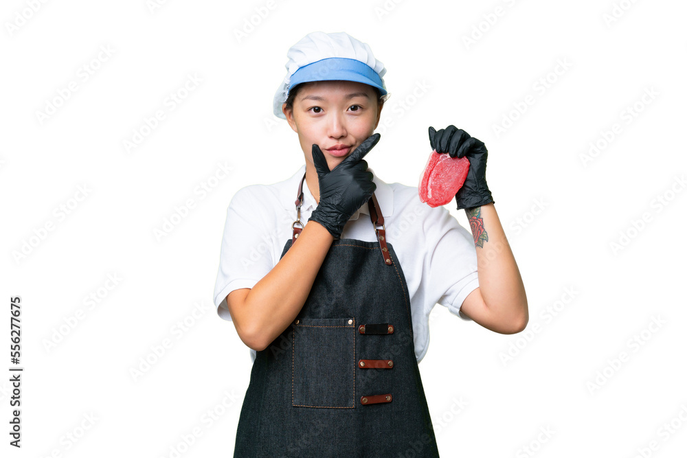 Young caucasian woman wearing an apron and serving fresh cut meat over isolated background thinking Young caucasian woman wearing an apron and serving fresh cut meat over isolated background thinking