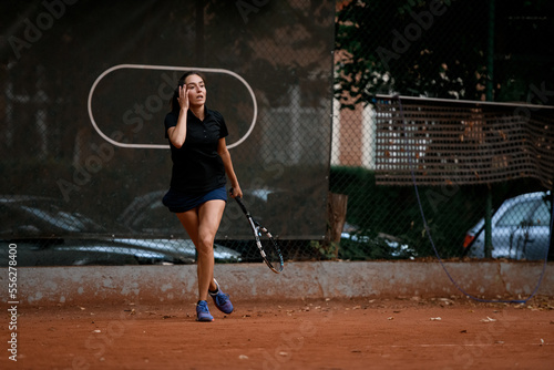 Female tennis player with racket in tournament match. Sports, active and fit woman at competitive or training exercise