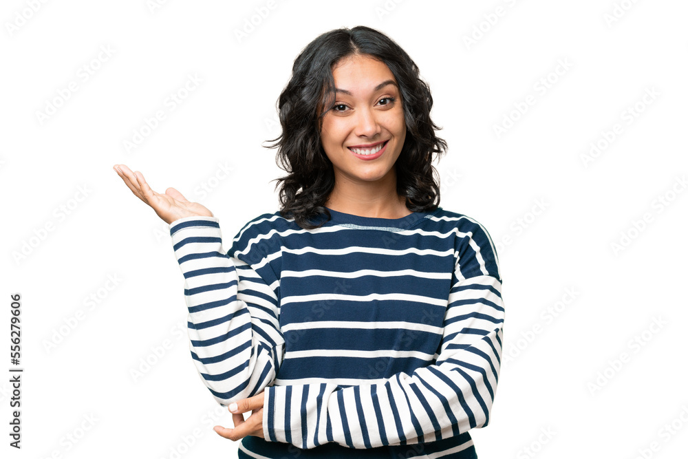 Young Argentinian woman over isolated background extending hands to the side for inviting to come Young Argentinian woman over isolated background extending hands to the side for inviting to come