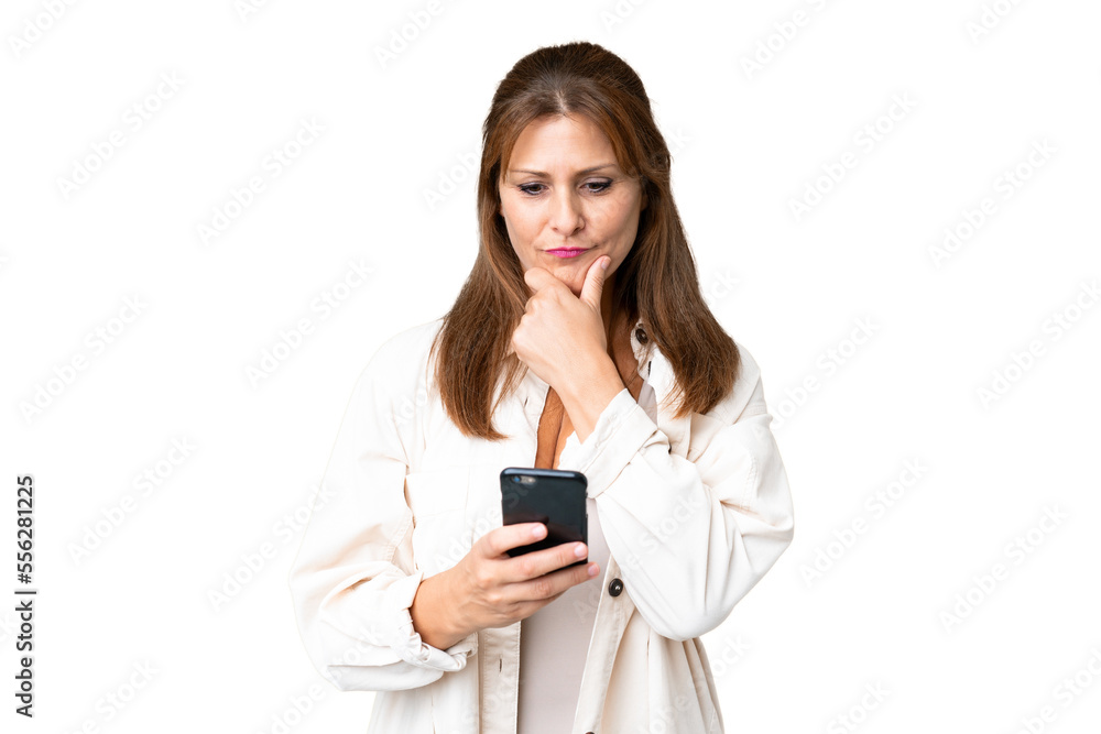 Middle age woman over isolated background thinking and sending a message Middle age woman over isolated background thinking and sending a message
