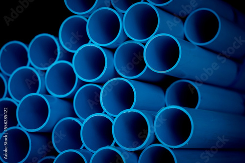 Background of the blue plastic pipes in stacked