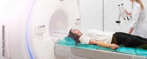 Medical CT or MRI Scan with a patient in the modern hospital laboratory. Interior of radiography department. Technologically advanced equipment in white room. Magnetic resonance diagnostics machine