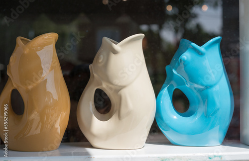 decorative water pitchers in a shop window photo