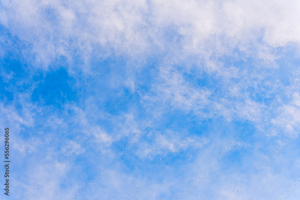 Natural blue sky with white puffy clouds, creative background.