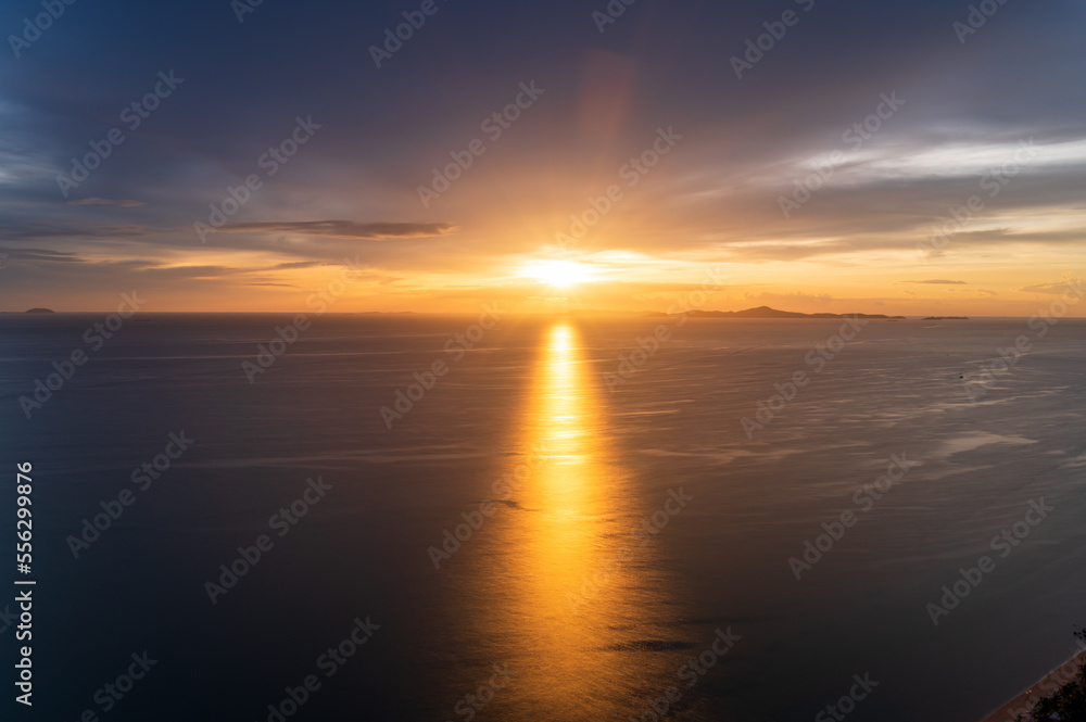 Dreamy sunset on tropical sea in Pattaya, Thailand. beautiful landscape of seascape with water reflection from sunlight. background for traveling and vacation.