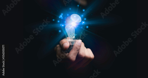 Businessman holding a light bulb, Creative new idea. Innovation, brainstorming, solution and inspiration concepts. imagination, creative thinking problem solving...