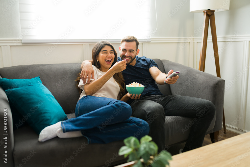 Excited couple enjoying a movie on a casual date