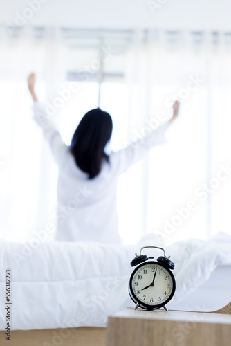 Cuadro en lienzo Alarm clock that is going to ring a in morning on background of woman in bed