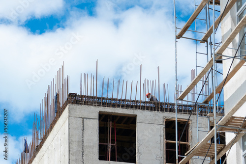 Construction of a new building. Building construction. Construction work on the upper floors of the building.