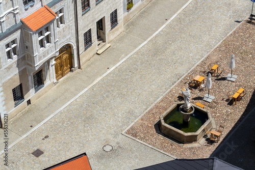 Aerial view of the cafe tables around the fountain on the square, sunny summer day photo