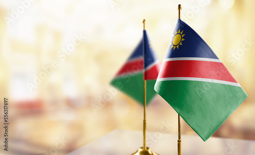 Small flags of the Namibia on an abstract blurry background photo