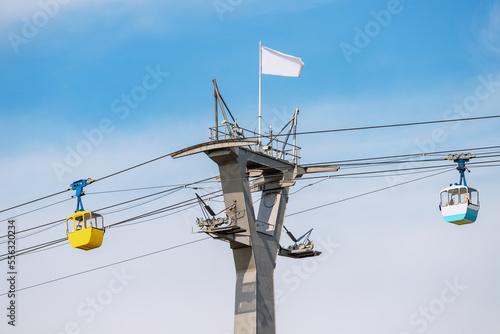 Cable car gondolas transporting tourists from station in Rheinpark in Cologne, Germany. Sightseeing and attractions concept