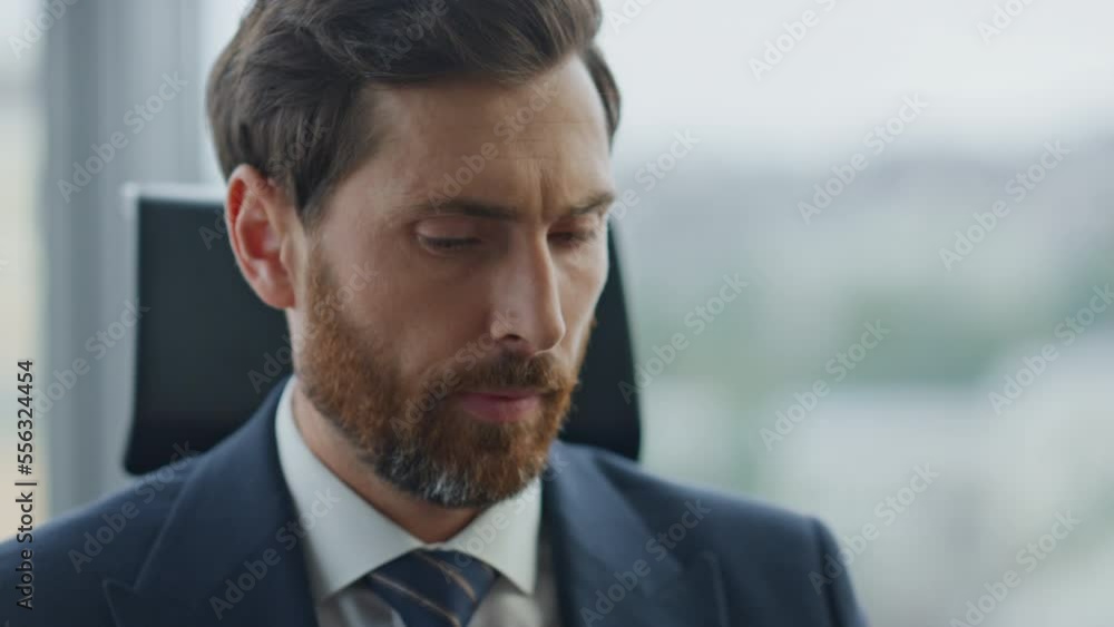 Exhausted boss calling phone sitting company office close up. Owner finish talk. Exhausted boss calling phone sitting company office close up. Owner finish talk.