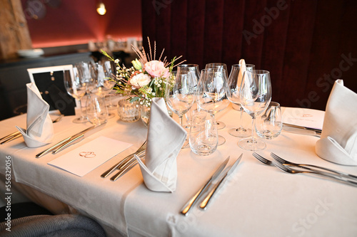Tables set for an event party or wedding reception. luxury elegant table setting dinner in a restaurant. glasses and dishes.