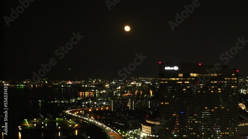 Wallpaper Mural FUKUOKA, JAPAN - NOV 2022 : Aerial high angle view of Fukuoka City and full moon at night. View around Tenjin and Nakasu downtown area. Travel and urban city nightlife concept video. Torontodigital.ca