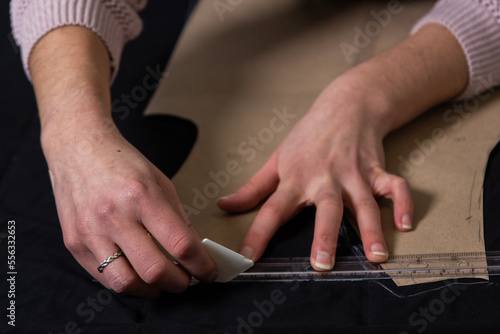 Seamstress works in the tailoring workshop