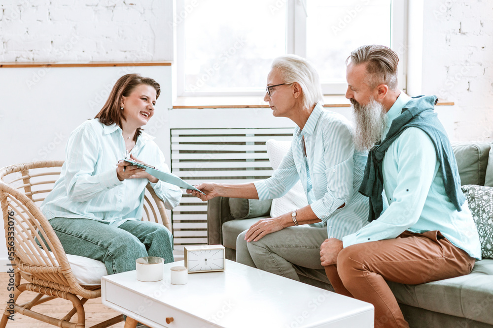 Fototapeta premium elderly couple beautiful man and `senior woman in office or cabinet of gerontologist psychologist doctor, geriatric for the elderly, active longevity