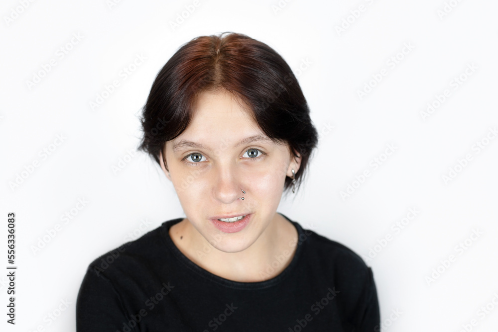 Portrait of a beautiful young teenage girl smiling and talking, she says encouraging words to herself, she needs support and understanding from others Portrait of a beautiful young teenage girl smiling and talking, she says encouraging words to herself, she needs support and understanding from others