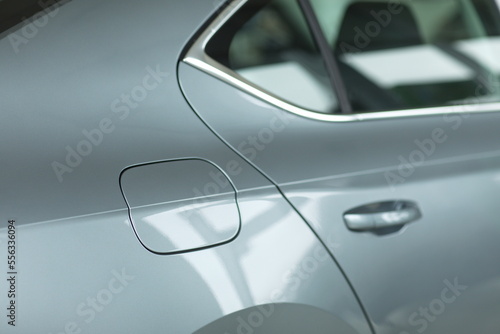 Close up of a closed petrol cap cover on a modern grey car. Oil tank cover for customers. Using wallpaper or background for transport and automotive image.