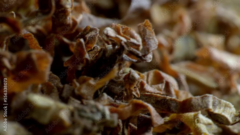 Crushed tobacco leaf close-up. macro photography. slow motion closeup Crushed tobacco leaf close-up. macro photography. slow motion closeup