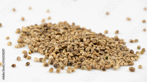 Hemp Seeds on a White Background, Macro. Organic Food. Dried Superfood. Hemp Seeds Texture Background