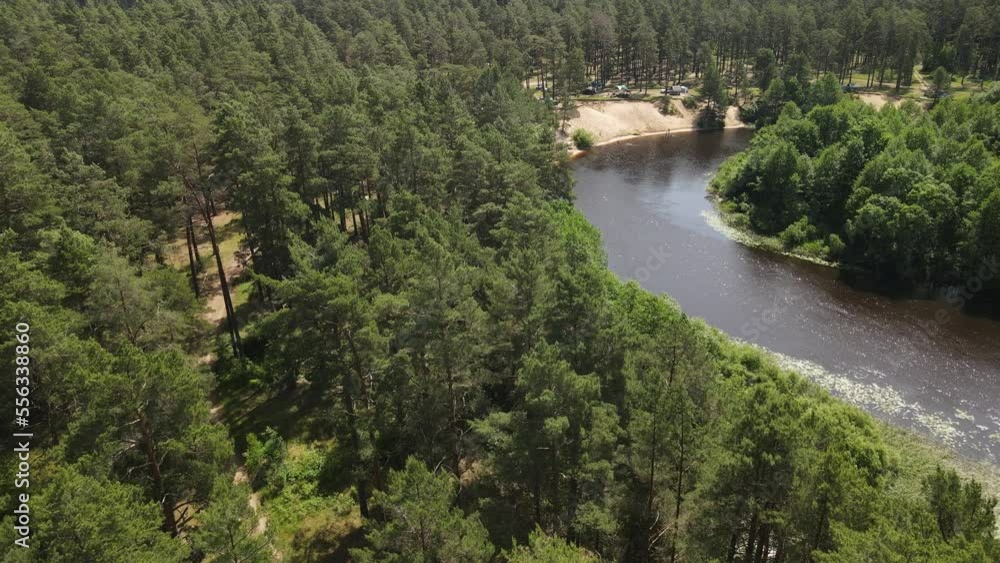 Aerial drone view of the river and green forests and fields on a summer day. Aerial drone view of the river and green forests and fields on a summer day.