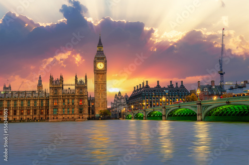 The famous Parliament House and Big Ben across the Thames Rives illuminated at sunset in London  England