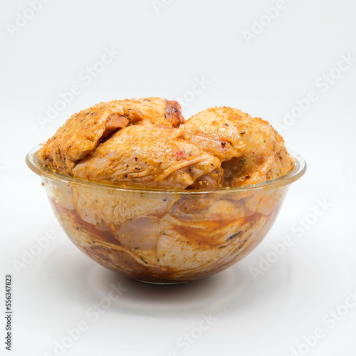 Marinated chicken on white background