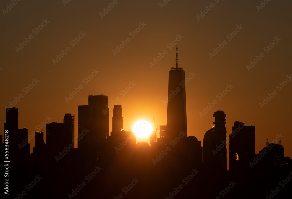 Sunset in the center of the Manhattan downtown skyline in New York City. Sunset in the center of the Manhattan downtown skyline in New York City.