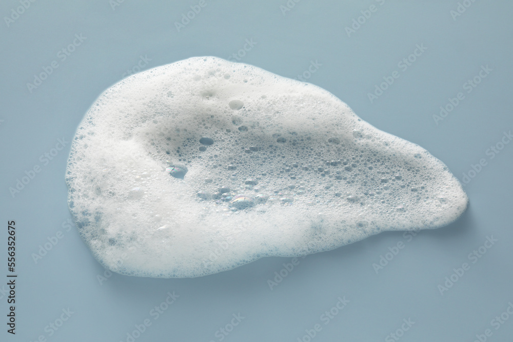 Smudge of white washing foam on color background, top view Smudge of white washing foam on color background, top view