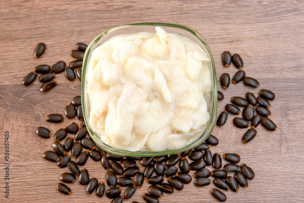 Soursop pulp, on a table in a glass container, soursop seeds, endemic to the tropics Soursop pulp, on a table in a glass container, soursop seeds, endemic to the tropics
