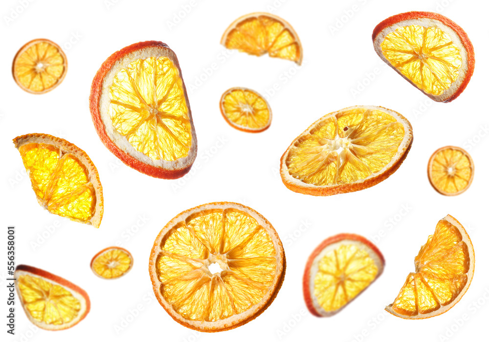 Many dry orange slices falling on white background Many dry orange slices falling on white background