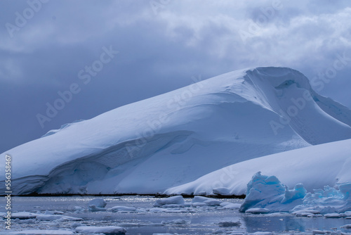 Antarctica Landscape in later winter, early spring.  With snow covering the rocky islands. 