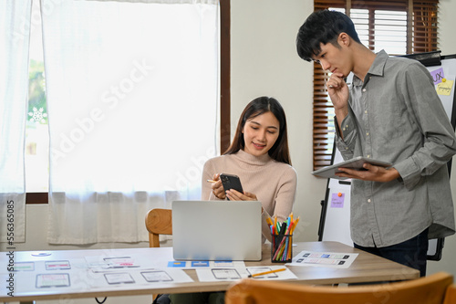 Photography Professional Asian male and female developers are in the meeting room, working t